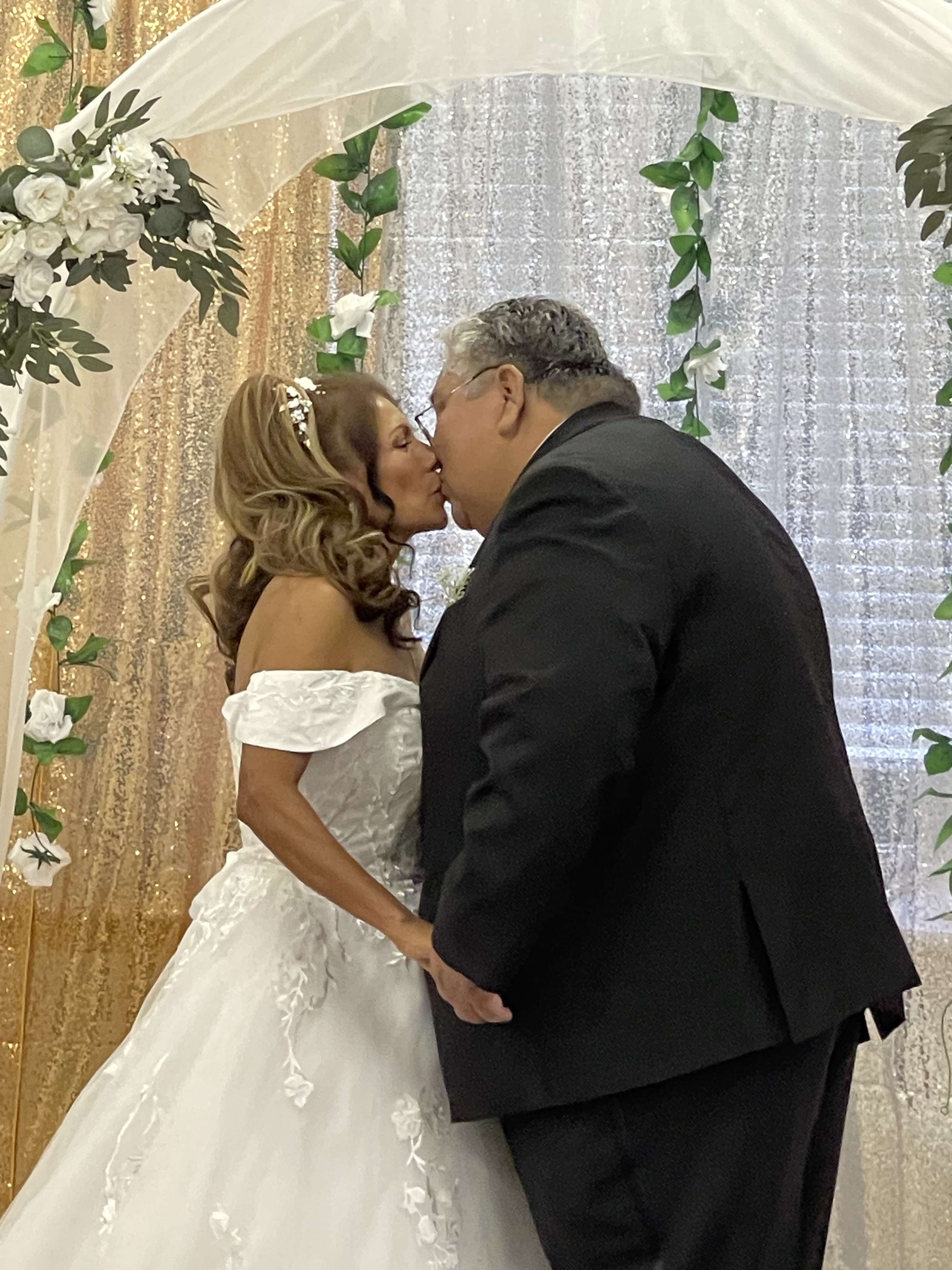 Bride and groom have their first kiss as a married couple