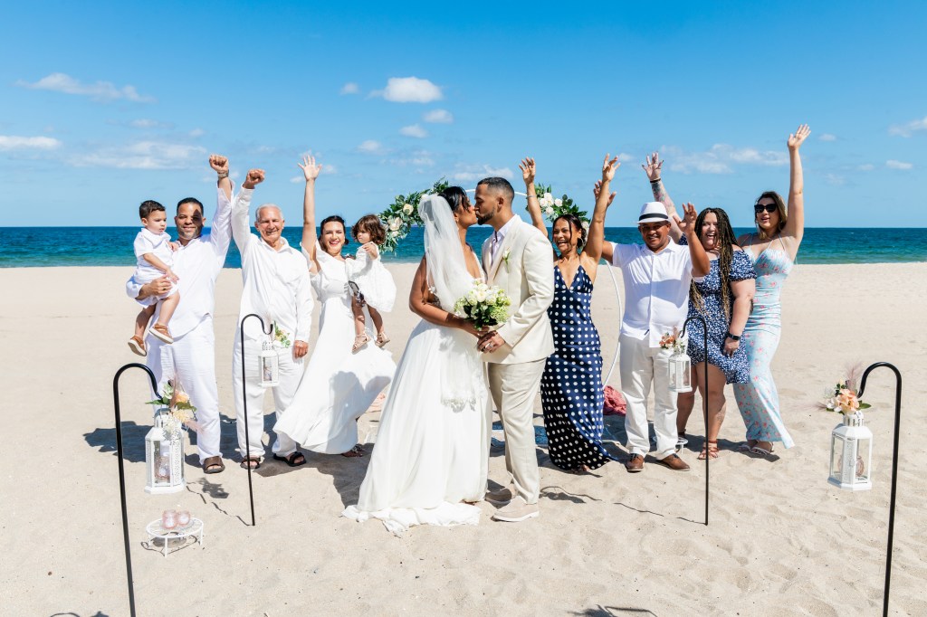 a group of people celebrating a couple getting married in Fort Lauderdale beach